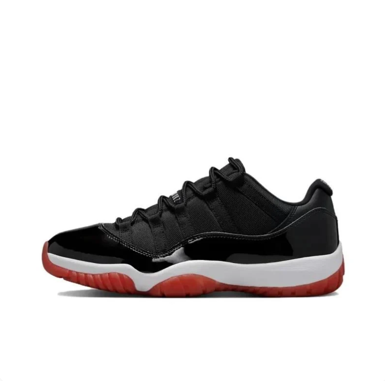 Air Jordan 11 Low Sneakers in Black, White and Red