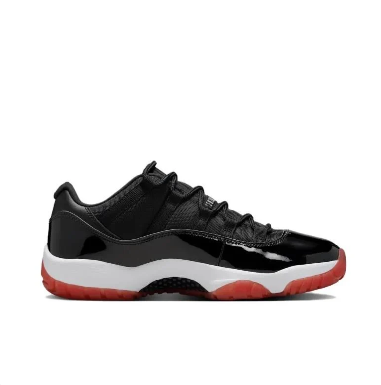 Air Jordan 11 Low Sneakers in Black, White and Red