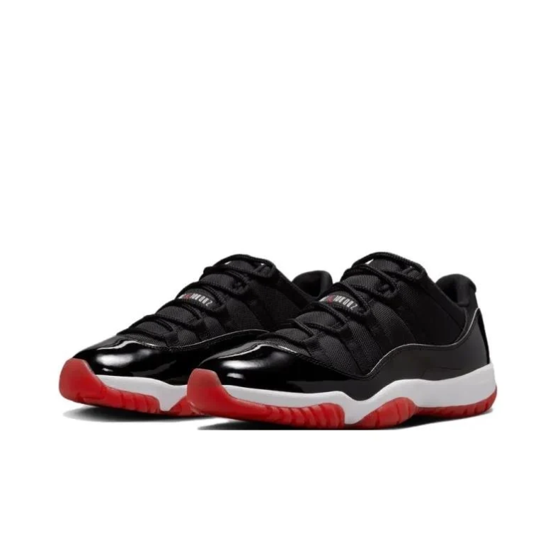 Air Jordan 11 Low Sneakers in Black, White and Red