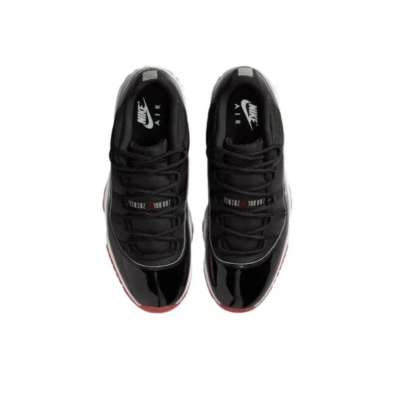 Air Jordan 11 Low Sneakers in Black, White and Red