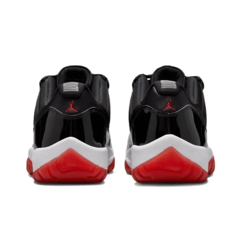 Air Jordan 11 Low Sneakers in Black, White and Red
