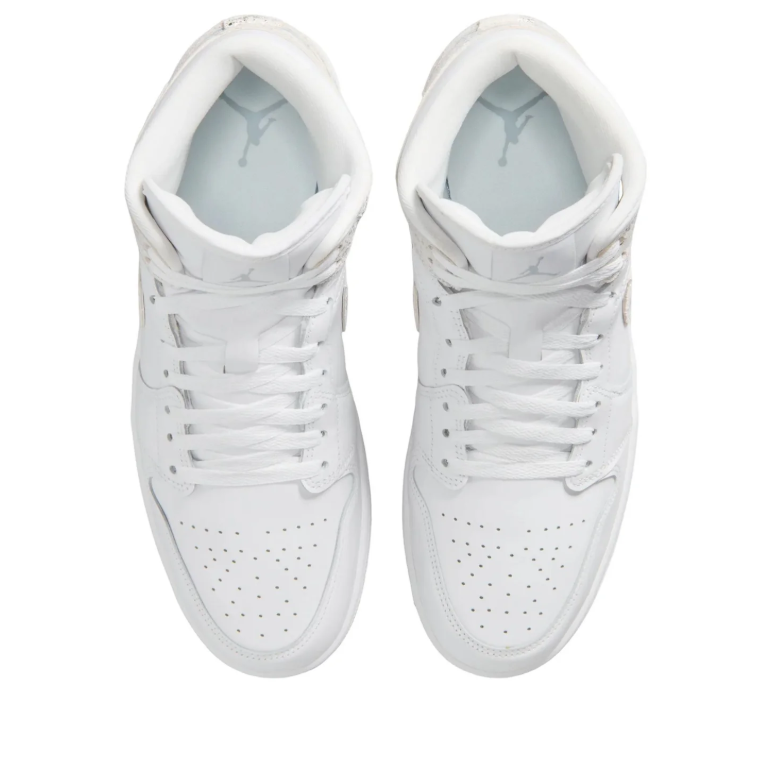 Air Jordan 1 Mid Sneakers in White with Metallic Silver Accents